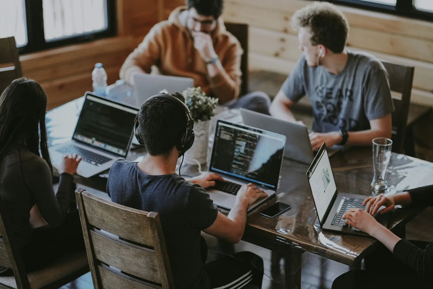 Creative collaborators developing ideas around a table